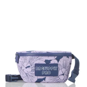 A close-up of a tyvek fanny pack featuring a full floral print and branded with "BAGSUPPLY PRO". This bag is customizable and ideal for beach outings, providing both style and practicality